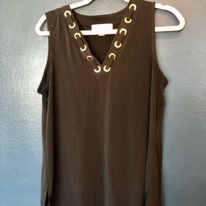 Michael Kors black v neck top with gold circles. Size medium
